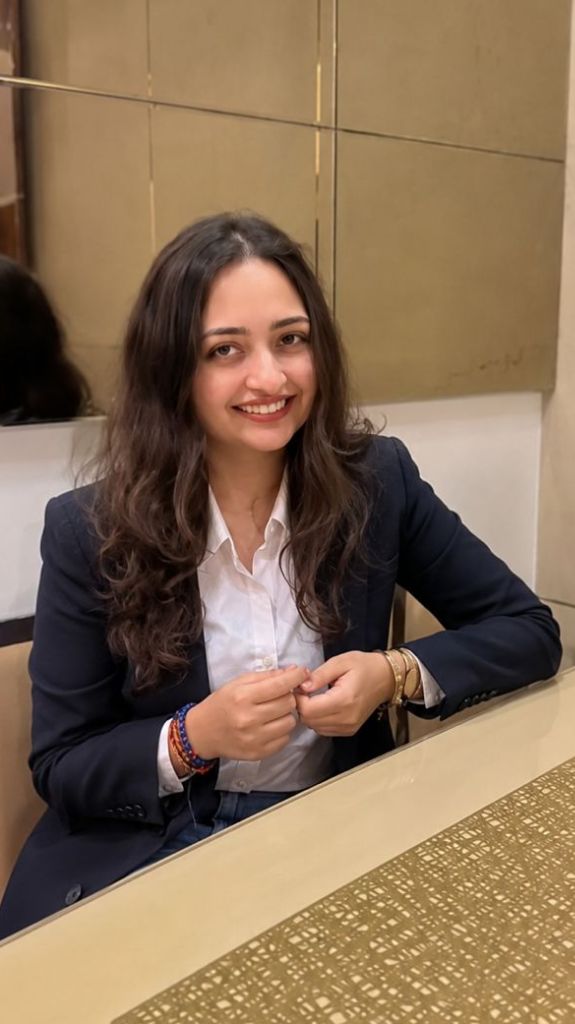 Aayushi Parmar professional portrait in formal navy suit